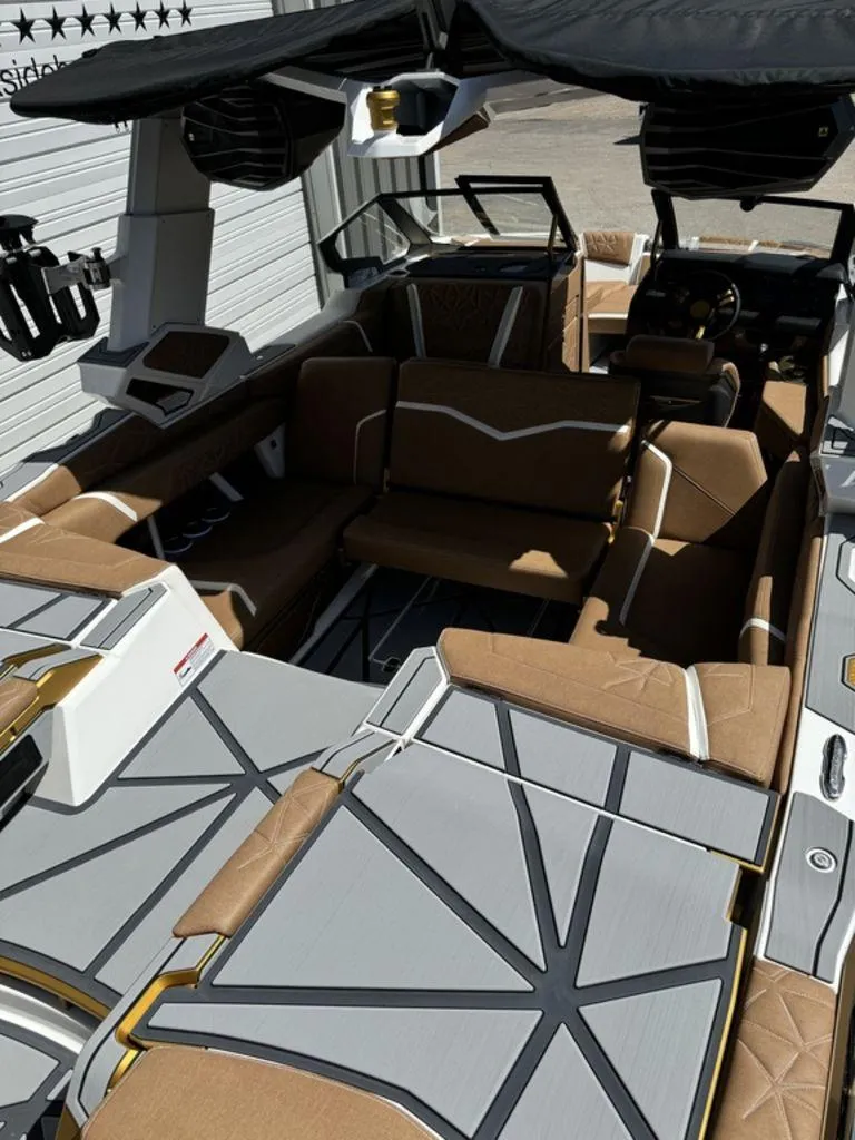 Slide: The Image of Luxurious interior of 2025 Nautique PARAGON 23 boat with modern seating and design. - 13