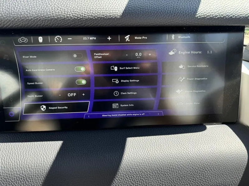 Slide: The Image of 2025 Nautique PARAGON 23 dashboard display with various control settings and features. - 15