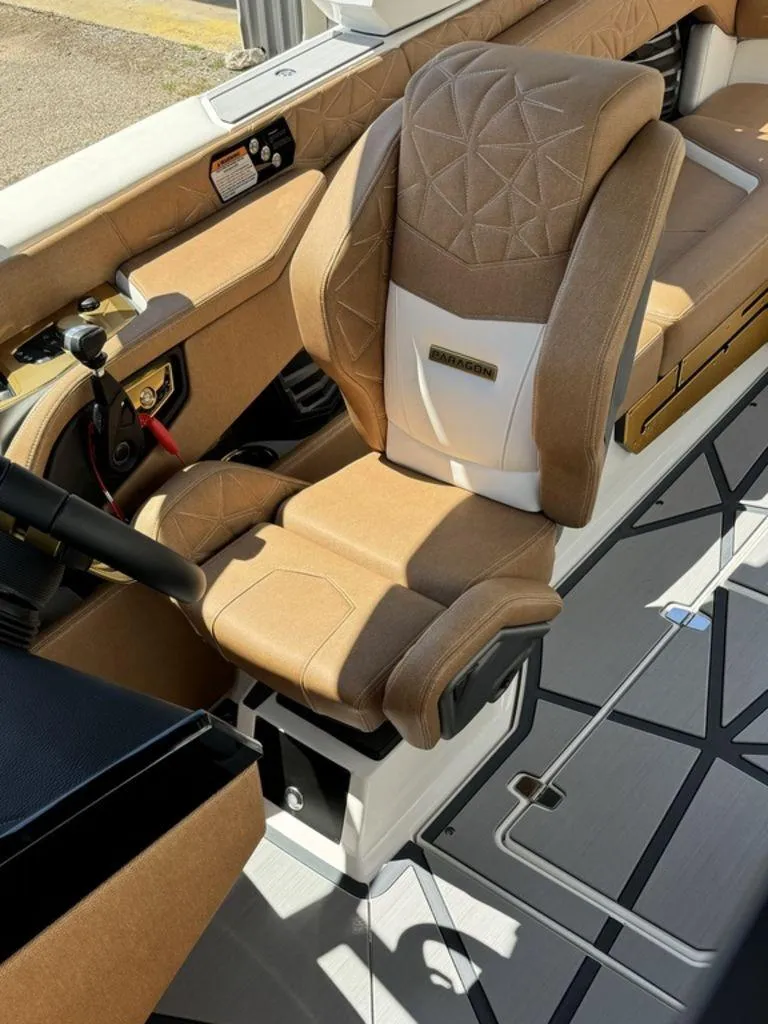 Slide: The Image of 2025 Nautique PARAGON 23 interior with luxurious tan seating and modern design. - 3