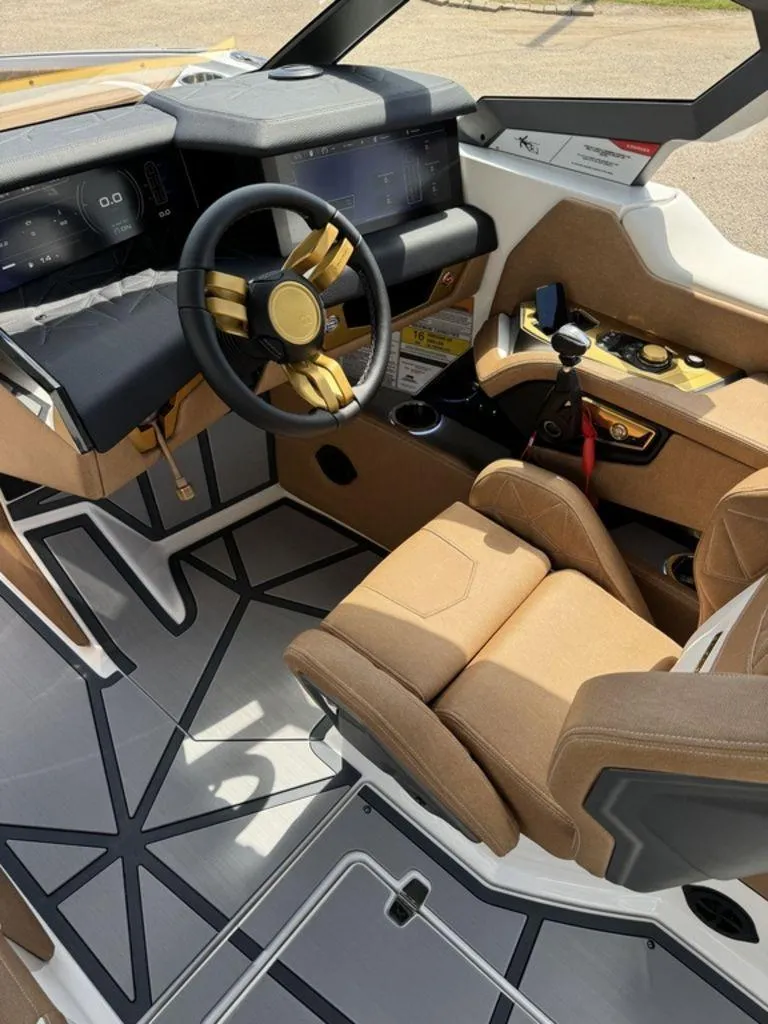 Slide: The Image of 2025 Nautique PARAGON 23 boat interior with modern dashboard and luxurious seating. - 5