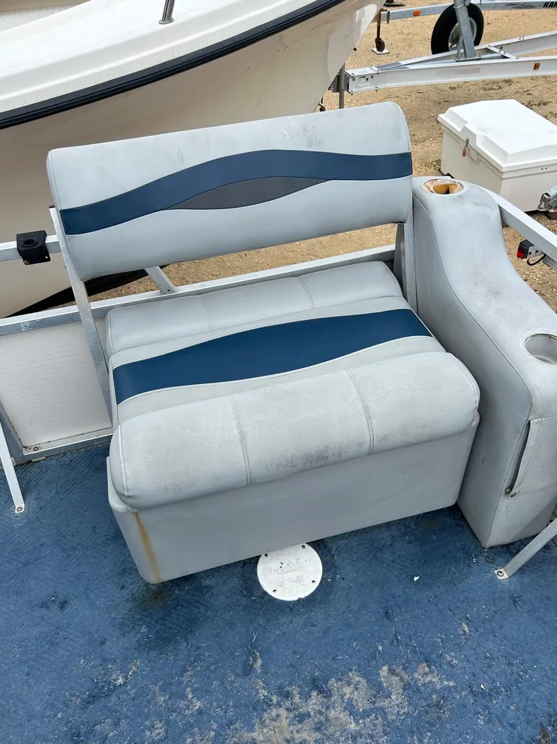 Slide: The Image of 2003 Starcraft 200 Fish Pontoon seat with blue and gray upholstery. - 12