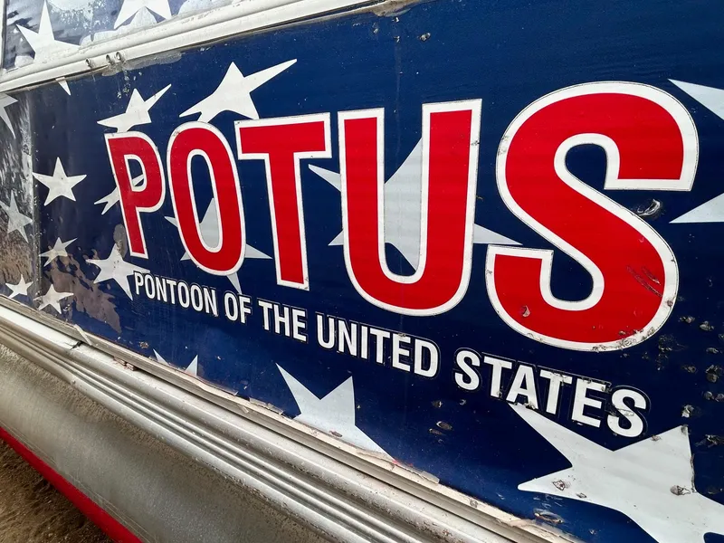 Slide: The Image of 2003 Starcraft 200 Fish Pontoon with "POTUS" patriotic design and stars. - 2