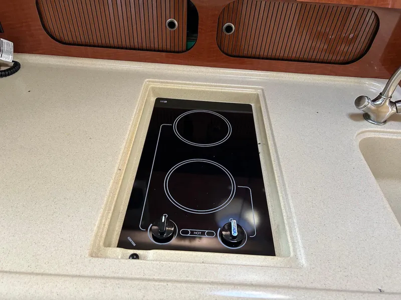 Slide: The Image of Stovetop on 2005 Sea Ray 340 Sundancer yacht kitchen counter. - 13