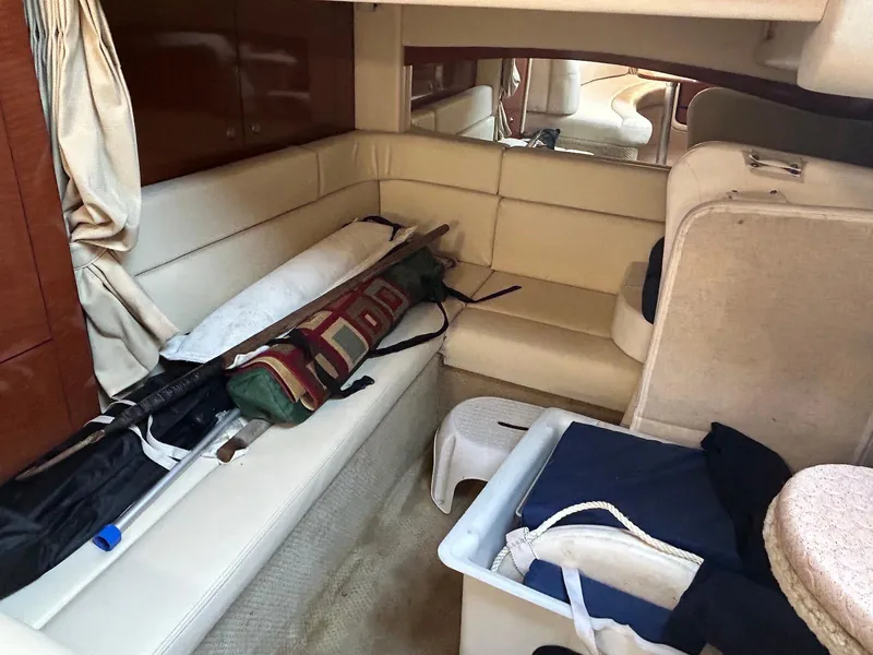 Slide: The Image of Interior cabin of a 2005 Sea Ray 340 Sundancer with seating and storage. - 14