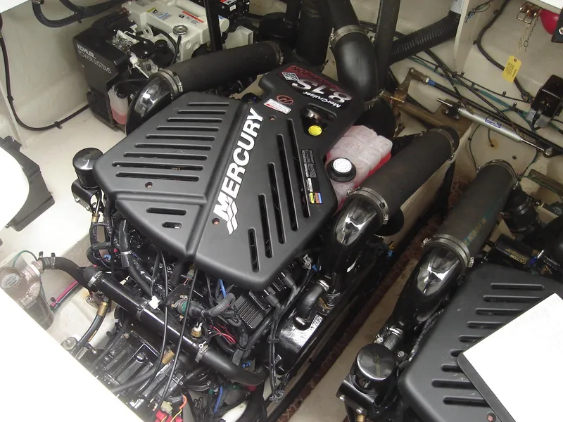 Slide: The Image of Engine room of 2005 Sea Ray 340 Sundancer with Mercury engines. - 18