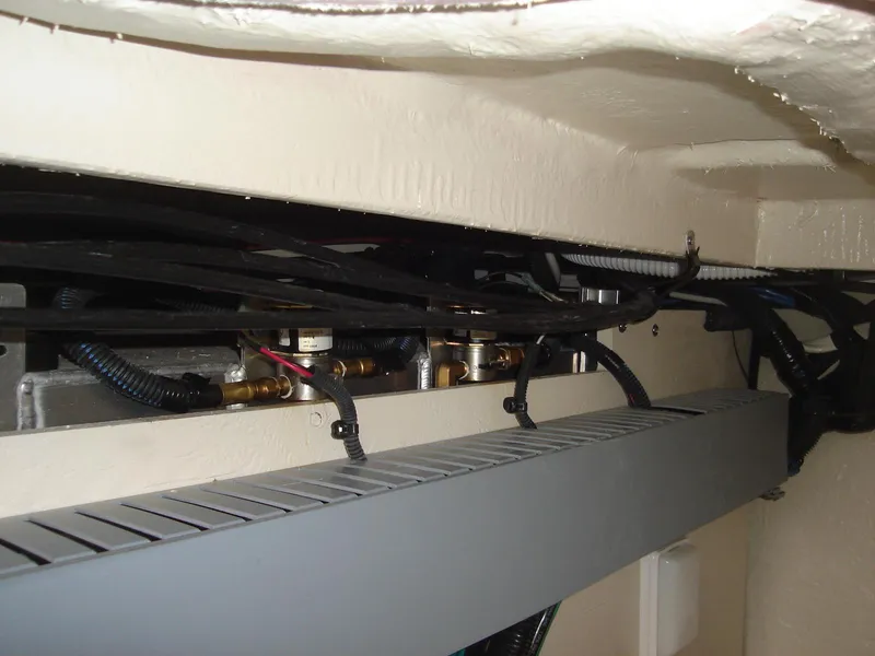 Slide: The Image of Engine compartment of a 2005 Sea Ray 340 Sundancer with visible wiring and components. - 21