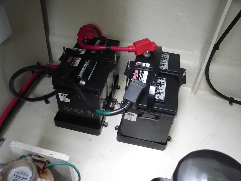 Slide: The Image of Batteries in a 2005 Sea Ray 340 Sundancer boat engine compartment. - 23