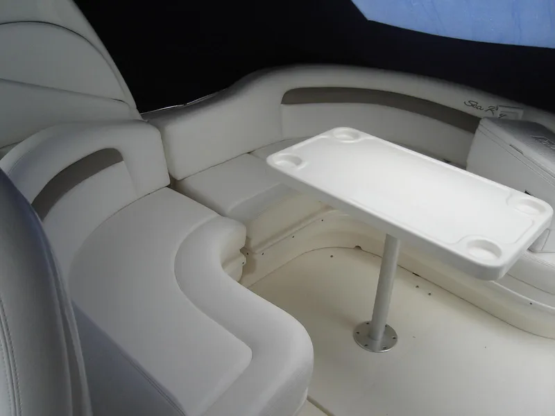 Slide: The Image of 2005 Sea Ray 340 Sundancer interior with white seating and table. - 9