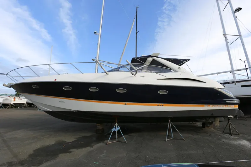 Slide: The Image of 1998 Sunseeker Camargue 44 yacht on dry dock, side view. - 0