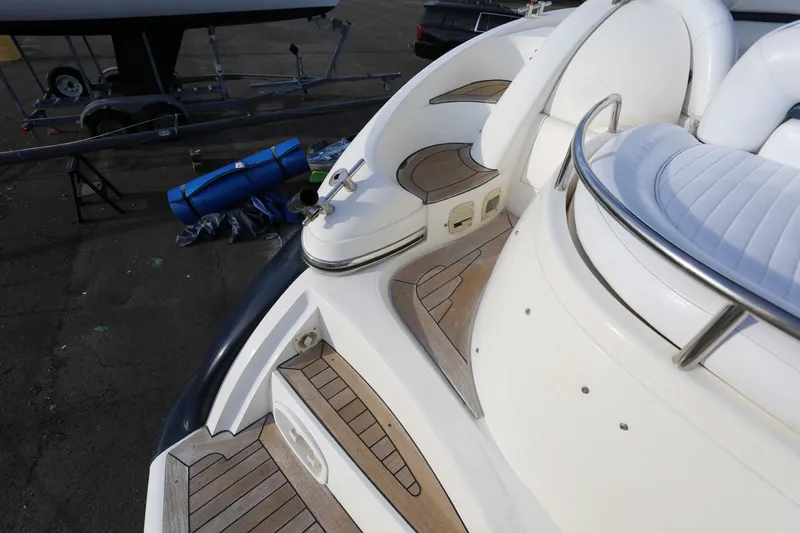 Slide: The Image of Sunseeker Camargue 44 yacht, 1998 model, featuring elegant teak decking and white seating. - 18