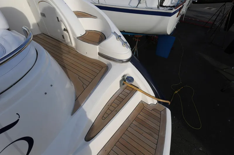 Slide: The Image of Sunseeker Camargue 44 yacht, 1998 model, featuring teak deck and mooring line. - 19