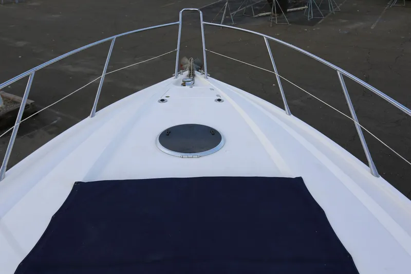 Slide: The Image of Bow view of 1998 Sunseeker Camargue 44 yacht with sleek deck design. - 21