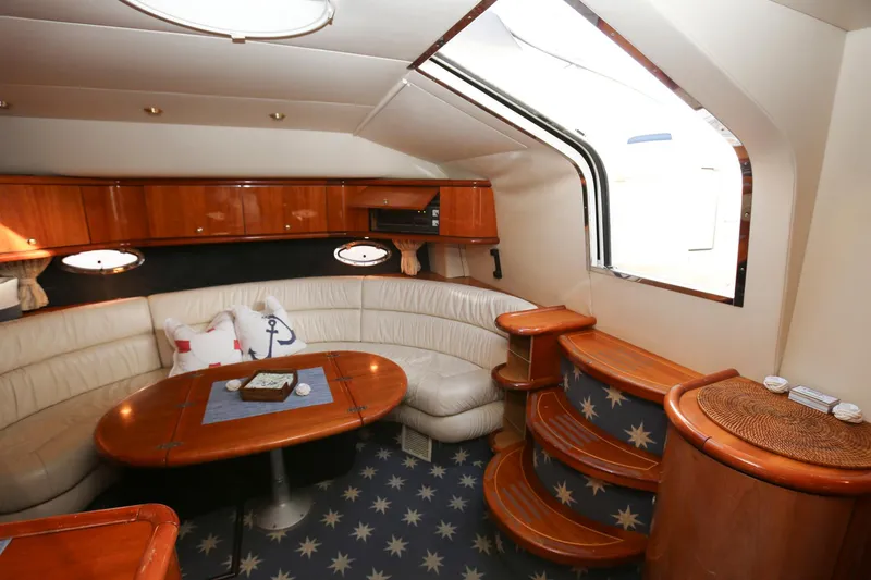 Slide: The Image of Luxurious interior of 1998 Sunseeker Camargue 44 yacht with elegant seating and wooden accents. - 28