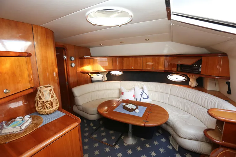 Slide: The Image of Luxurious interior of 1998 Sunseeker Camargue 44 yacht with elegant wood finish and cozy seating. - 29