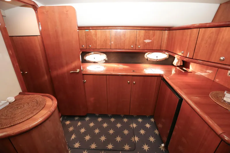 Slide: The Image of Luxurious wooden interior of 1998 Sunseeker Camargue 44 yacht kitchen area. - 31