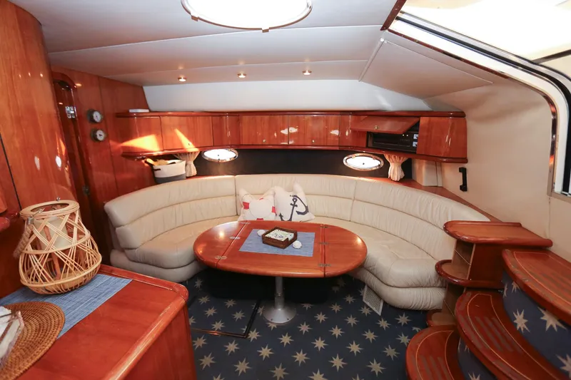 Slide: The Image of Luxurious interior of 1998 Sunseeker Camargue 44 yacht with elegant seating and wooden finishes. - 37