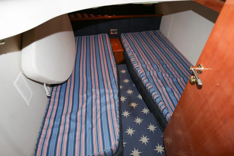 Slide: The Image of Interior cabin of 1998 Sunseeker Camargue 44 with twin striped beds. - 43
