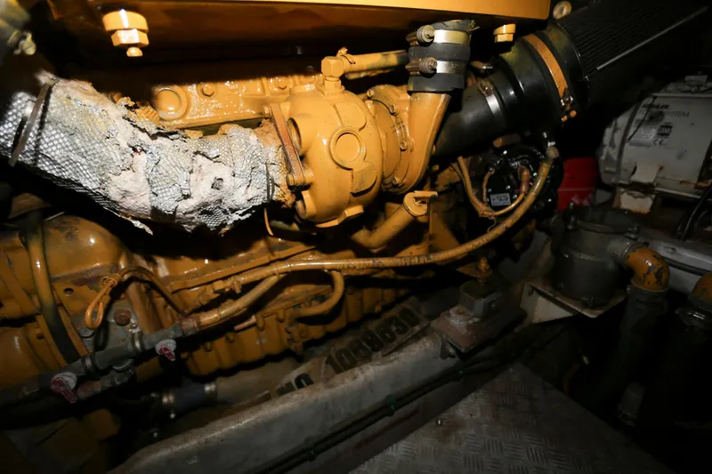 Slide: The Image of Engine compartment of a 1998 Sunseeker Camargue 44 yacht, showcasing mechanical components. - 47