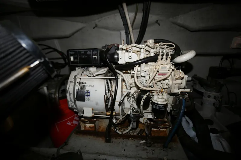 Slide: The Image of Engine room of 1998 Sunseeker Camargue 44 with Kohler generator. - 48