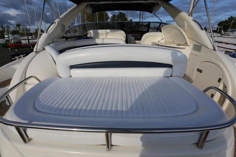 Slide: The Image of Sunseeker Camargue 44 yacht interior, 1998 model, featuring white leather seating and sleek design. - 5