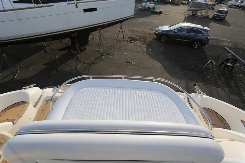 Slide: The Image of Sunseeker Camargue 44 yacht, 1998 model, featuring a spacious sunbed on deck. - 6