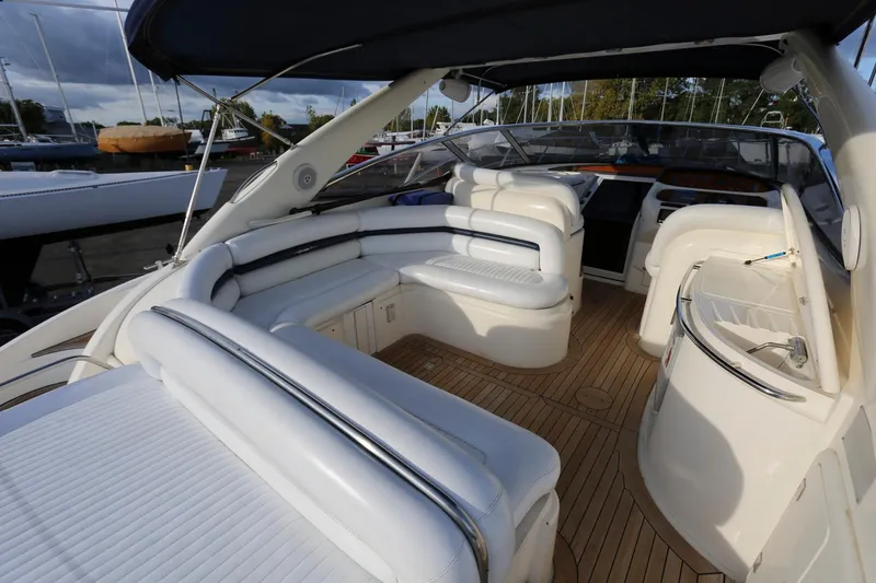 Slide: The Image of Luxurious 1998 Sunseeker Camargue 44 yacht interior with white seating and teak flooring. - 7