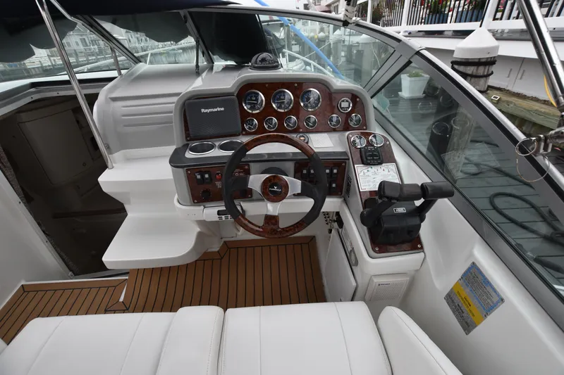 Slide: The Image of 2004 Formula 27 PC boat cockpit with steering wheel and control panel. - 3