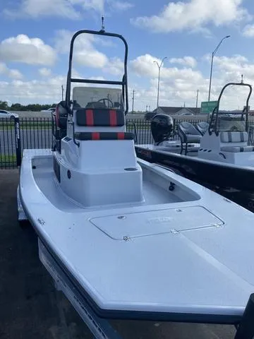 Slide: The Image of 2024 Majek M2 ILLUSION boat with sleek design, docked under a partly cloudy sky. - 4