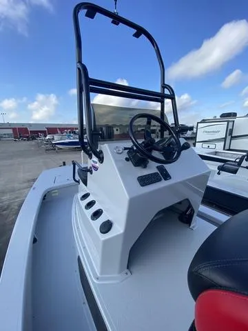 Slide: The Image of 2024 Majek M2 ILLUSION boat console with steering wheel, outdoor setting, blue sky. - 8