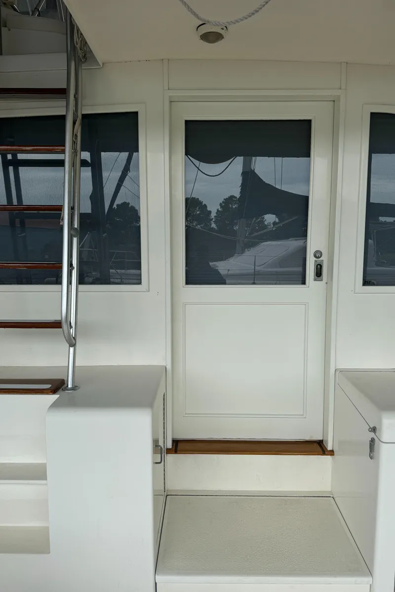 Slide: The Image of 1992 Post 46 Sportfish yacht entrance with stairs and door. - 11