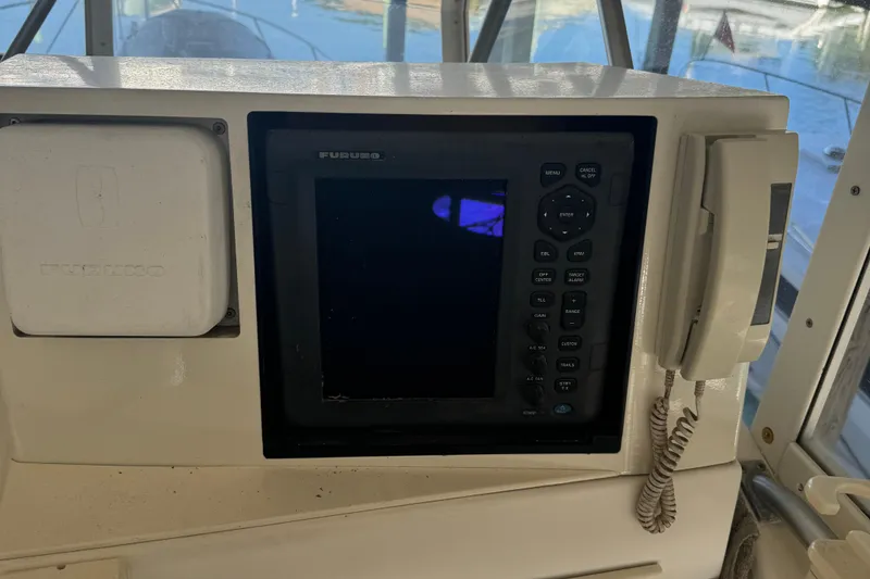 Slide: The Image of Control panel of a 1992 Post 46 Sportfish boat with navigation equipment. - 25