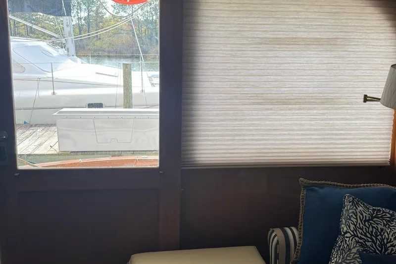 Slide: The Image of Interior view of a 1992 Post 46 Sportfish yacht with window and seating area. - 34