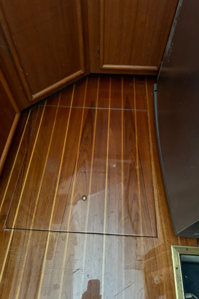 Slide: The Image of Wooden interior flooring of a 1992 Post 46 Sportfish boat. - 36