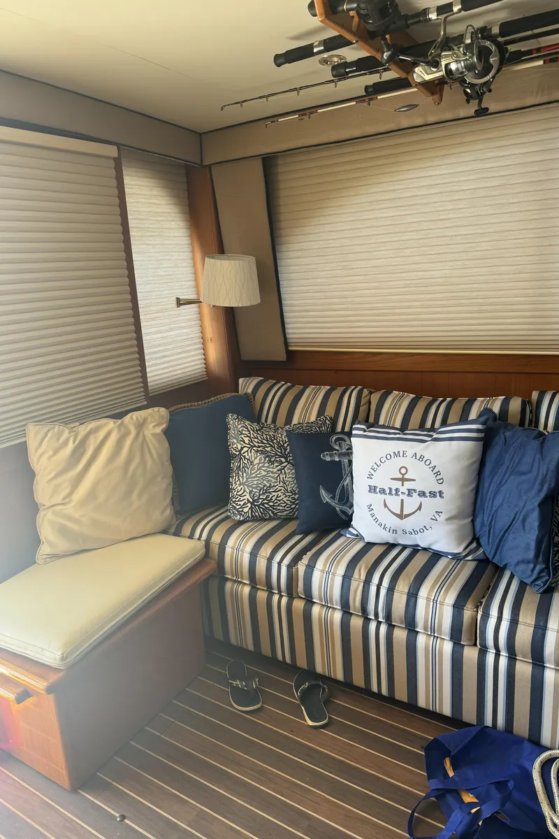 Slide: The Image of Cozy interior of 1992 Post 46 Sportfish with striped sofa and nautical decor. - 37