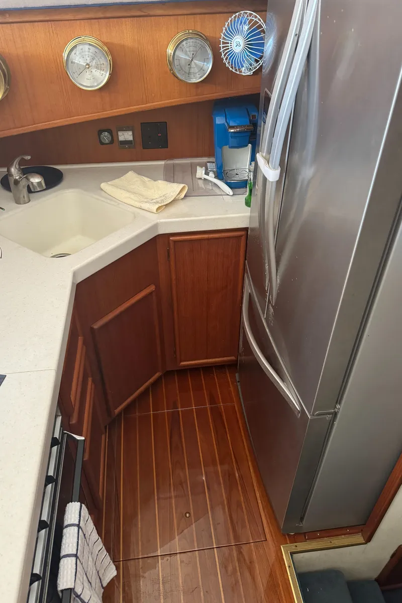 Slide: The Image of 1992 Post 46 Sportfish yacht kitchen with wood flooring and modern appliances. - 43