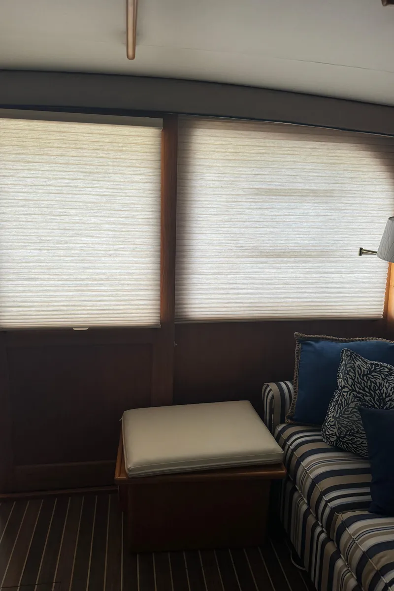 Slide: The Image of Interior of 1992 Post 46 Sportfish yacht with striped sofa and window blinds. - 45