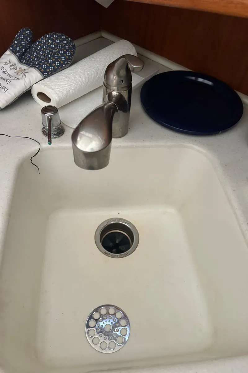 Slide: The Image of 1992 Post 46 Sportfish kitchen sink with stainless steel faucet and accessories. - 47