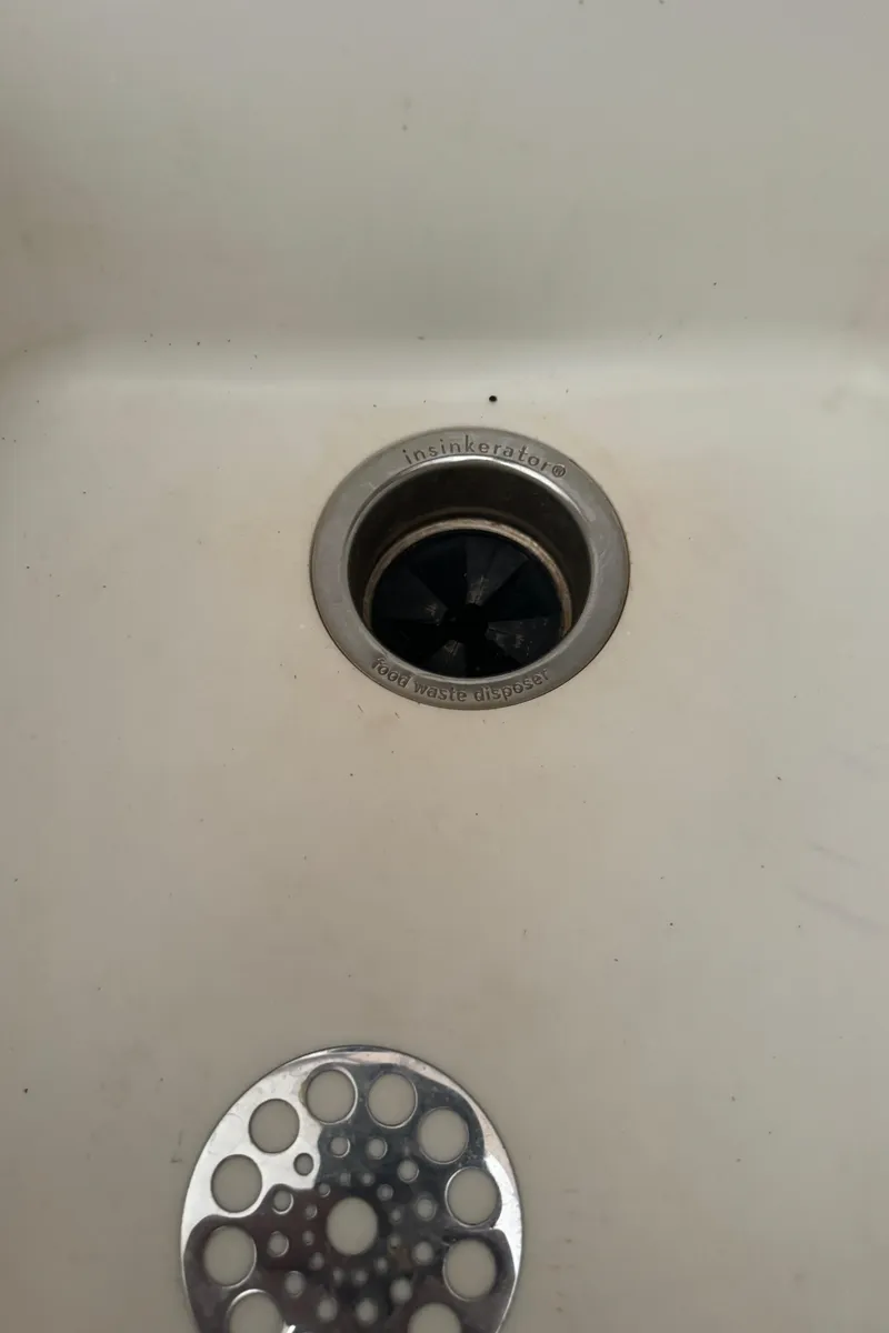 Slide: The Image of Close-up of a sink drain on a 1992 Post 46 Sportfish boat. - 48