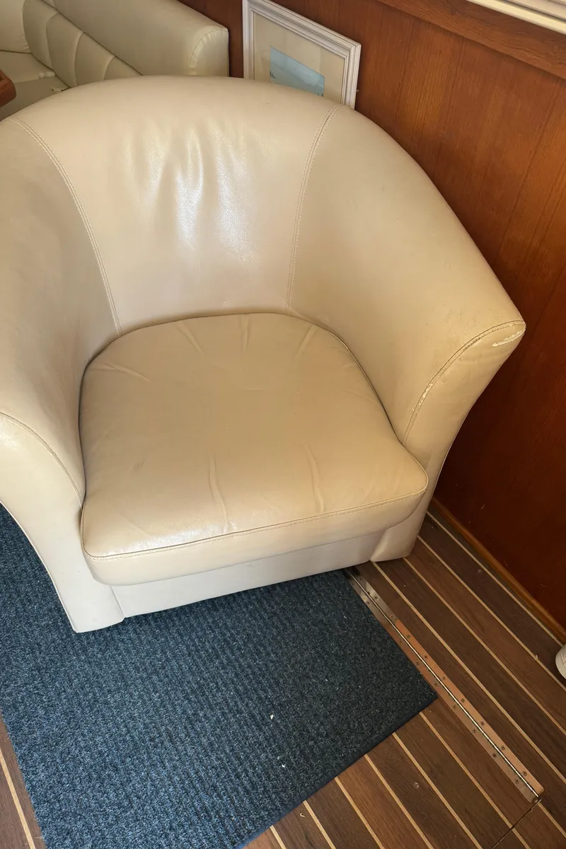 Slide: The Image of Cream leather chair on a 1992 Post 46 Sportfish boat with wooden flooring. - 39