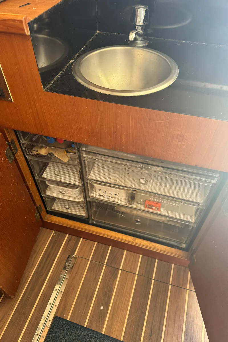 Slide: The Image of 1992 Post 46 Sportfish interior with sink and storage drawers. - 41