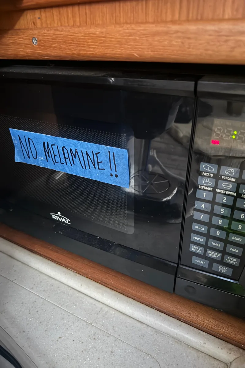 Slide: The Image of Microwave with "No Melamine" sign on a 1992 Post 46 Sportfish boat. - 46