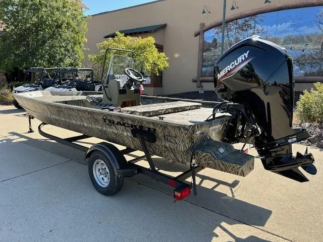 Slide: The Image of 2025 Tracker Grizzly 1860 CC boat with Mercury engine on trailer. - 2