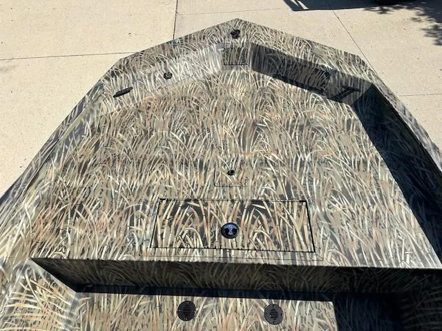 Slide: The Image of 2025 Tracker Grizzly 1860 CC boat with camouflage pattern on deck. - 4