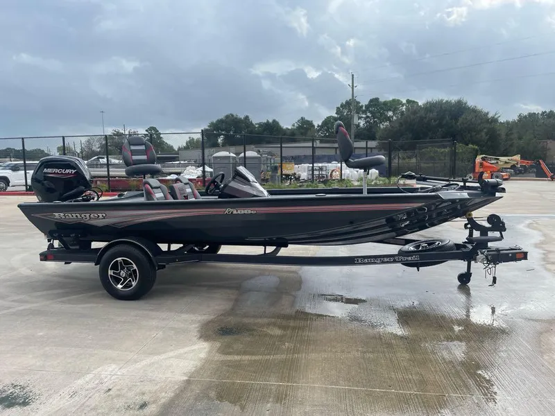 Slide: The Image of 2024 Ranger RT188C fishing boat on trailer, parked outdoors. - 1