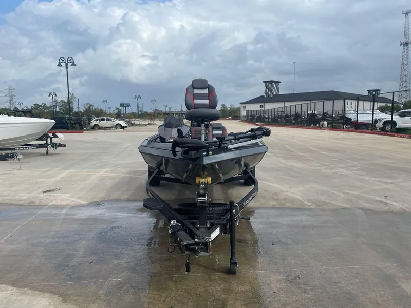 Slide: The Image of 2024 Ranger RT188C boat on trailer in parking lot, cloudy sky background. - 2