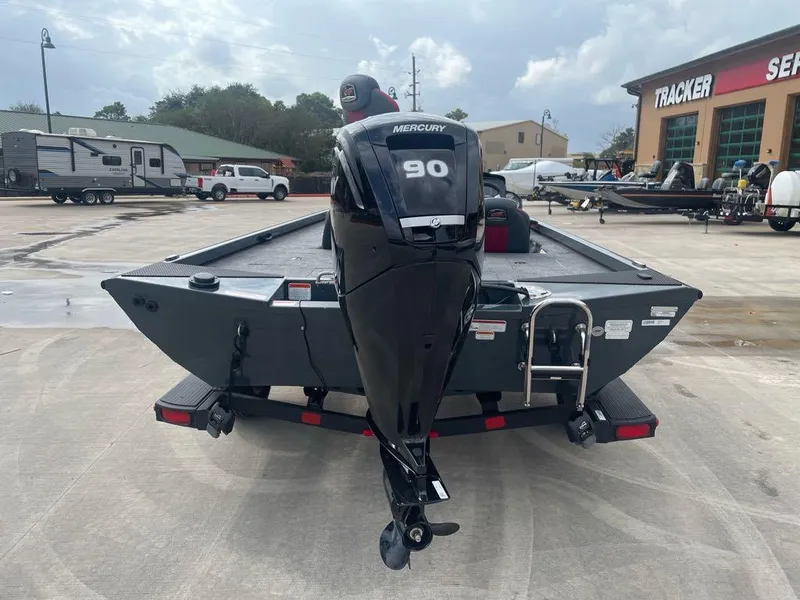Slide: The Image of 2024 Ranger RT188C boat with Mercury 90 engine, parked outdoors. - 3