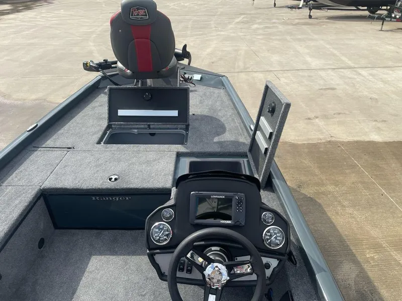 Slide: The Image of 2024 Ranger RT188C boat interior with steering console and storage compartments. - 4