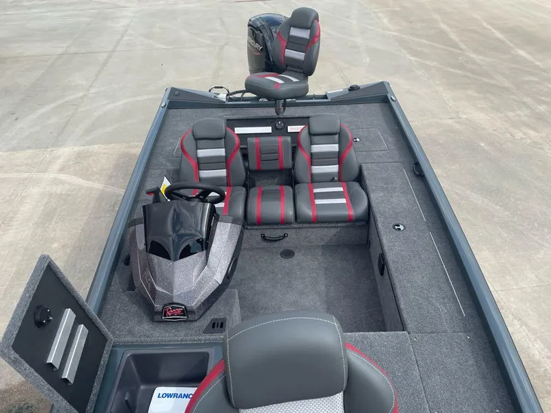Slide: The Image of 2024 Ranger RT188C boat interior with gray and red seating, steering console, and storage compartments. - 6