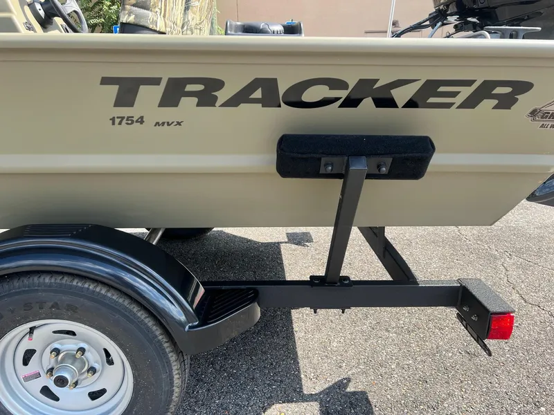 Slide: The Image of 2025 Tracker Grizzly 1754 SC boat on trailer, side view. - 2