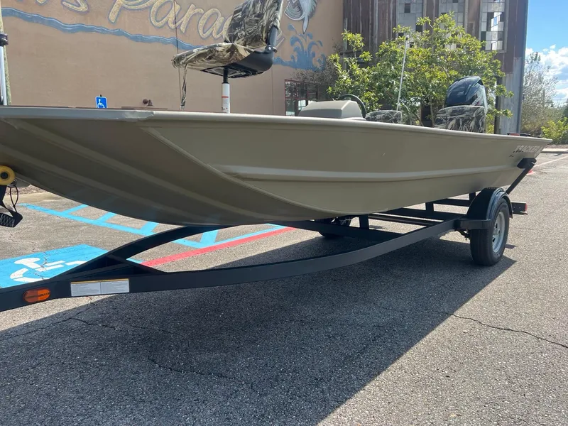 Slide: The Image of 2025 Tracker Grizzly 1754 SC boat on trailer in parking lot. - 3